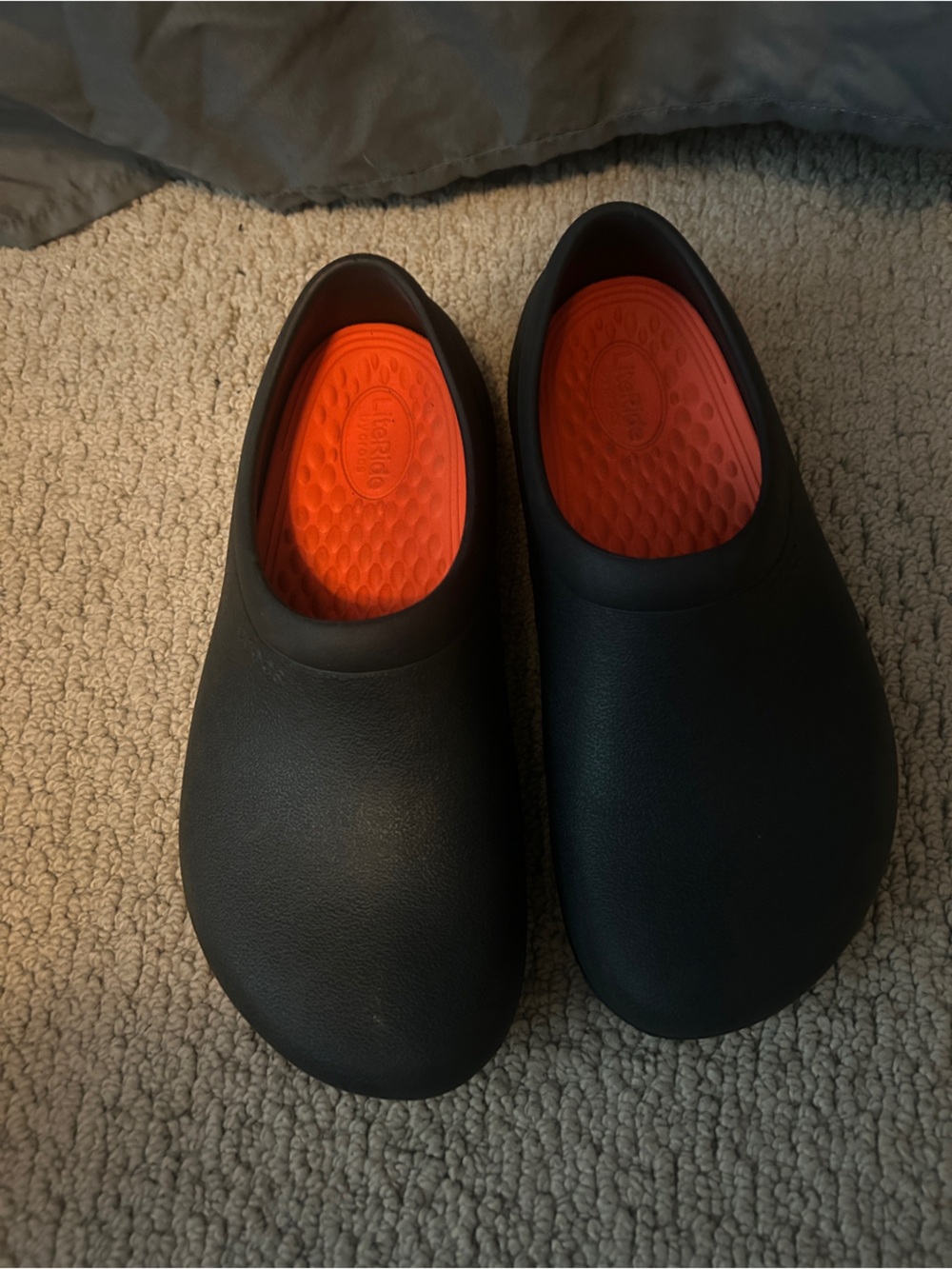 Women size 8 Black Crocs with Orange Insole